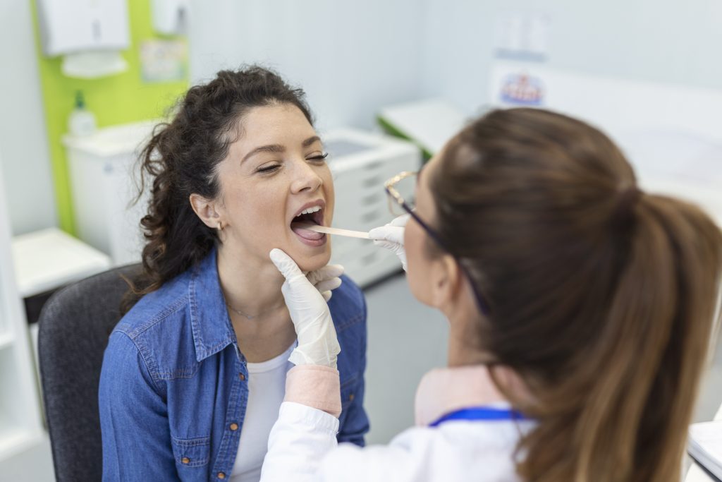 Woman is Getting bad breath care