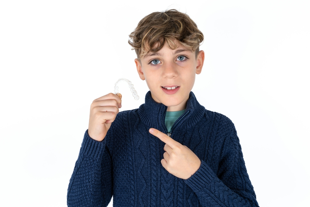 boy taking invisalign service